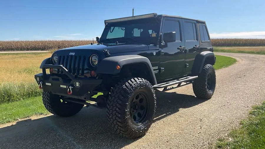 Black 2013 Jeep Wrangler Unlimited Sport