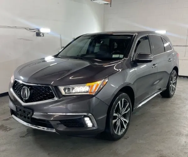A grey 2020 Acura MDX in a photo studio