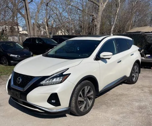 A white 2021 Nissan Murano in a cramped parking lot